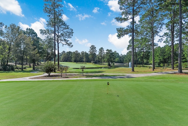 view of home's community featuring a lawn