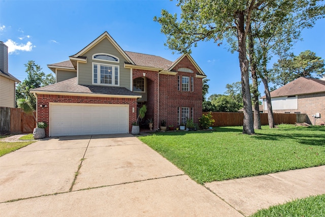 view of front facade with a garage and a front lawn