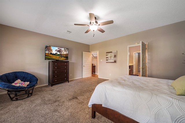 carpeted bedroom featuring ensuite bathroom and ceiling fan