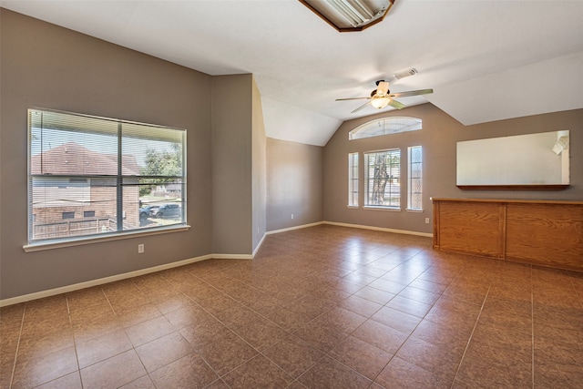 unfurnished living room featuring tile patterned flooring, ceiling fan, and vaulted ceiling