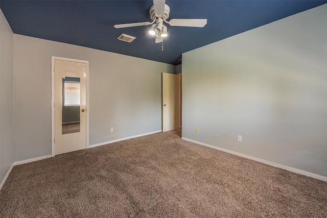 unfurnished bedroom with lofted ceiling, ceiling fan, and carpet