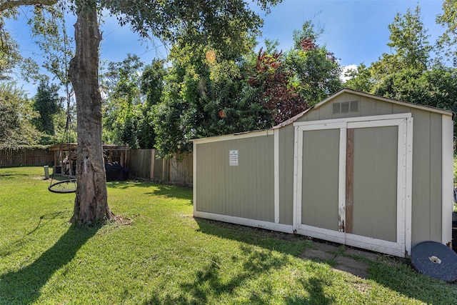 view of outbuilding featuring a yard