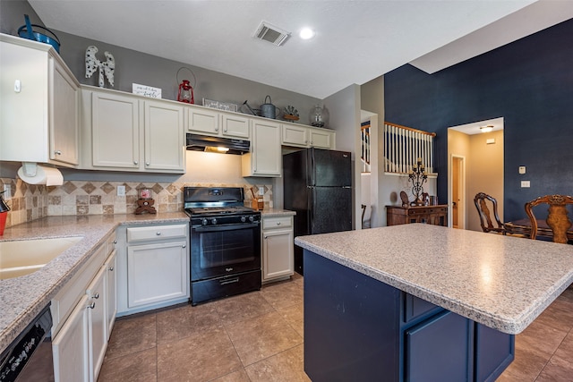 kitchen with backsplash, a center island, white cabinetry, sink, and black appliances