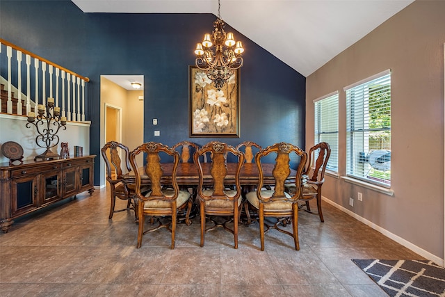 dining room featuring high vaulted ceiling and a chandelier