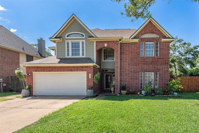 front of property featuring a garage and a front yard