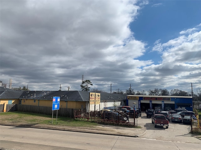 view of parking featuring a yard