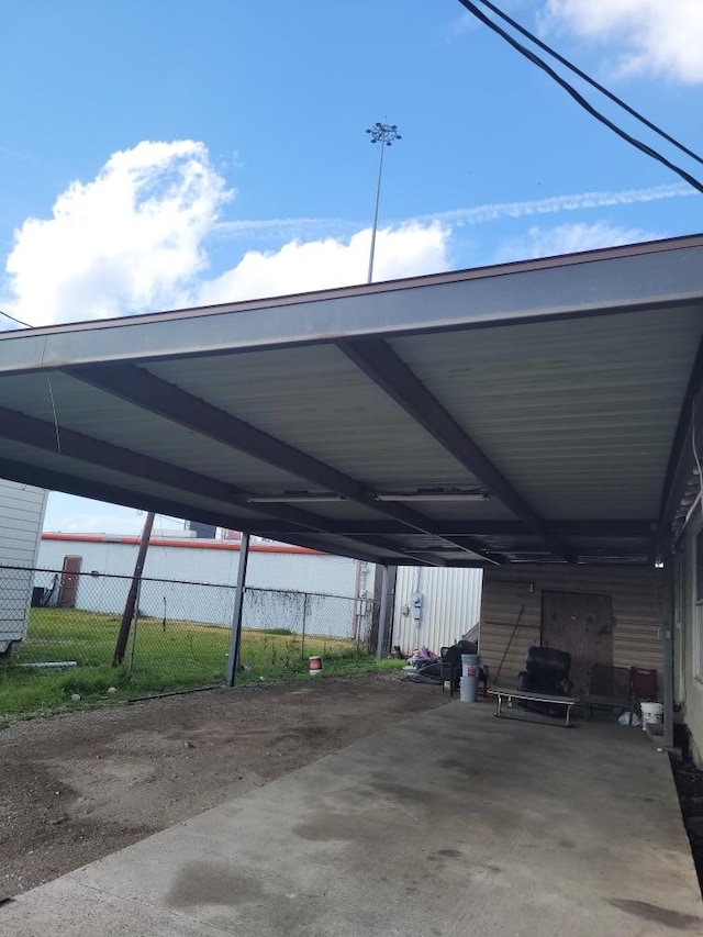 view of vehicle parking with a carport