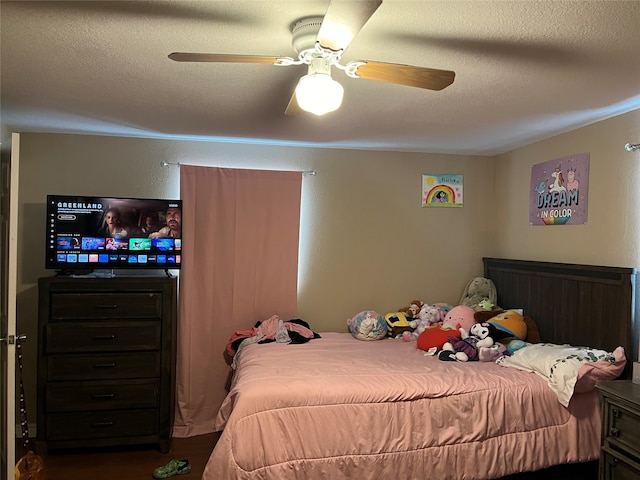 bedroom featuring a textured ceiling and ceiling fan