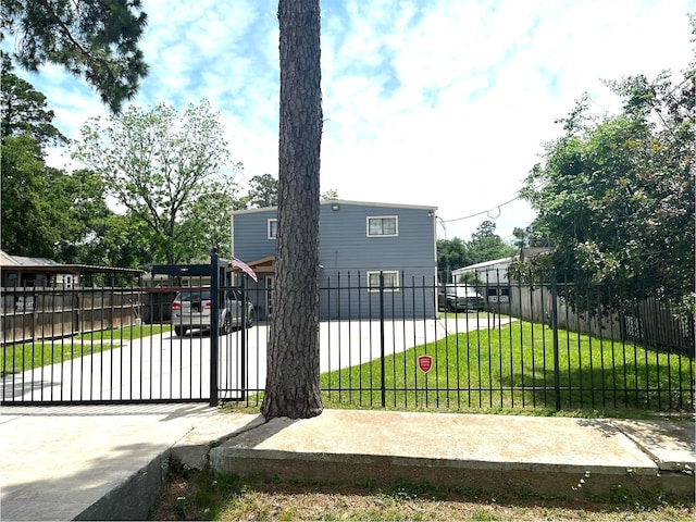 view of gate featuring a lawn