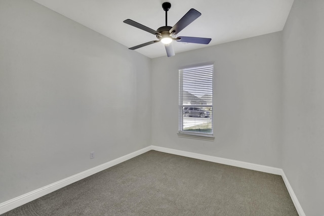 unfurnished room featuring ceiling fan and carpet floors