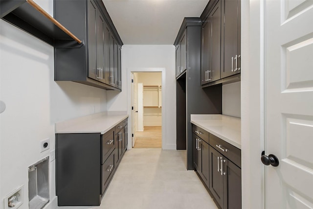 kitchen featuring dark brown cabinets