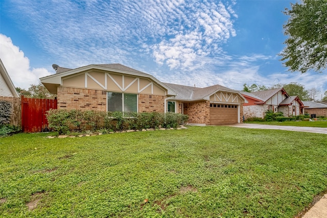 view of front of property with a garage and a front lawn