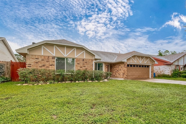 view of front of property featuring a garage and a front yard