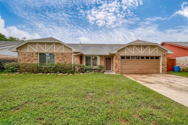 view of front facade with a front yard and a garage