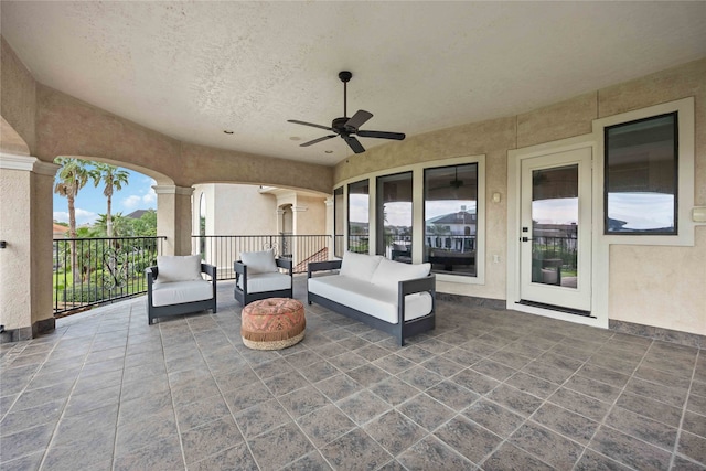 view of patio featuring an outdoor hangout area and ceiling fan