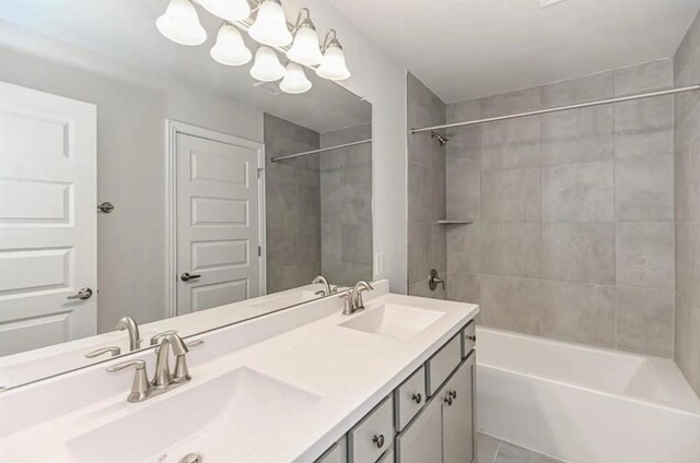 10 Greenbriar Loop, Angleton, TX 77515 - bathroom featuring double vanity,  shower combination, and tile patterned flooring