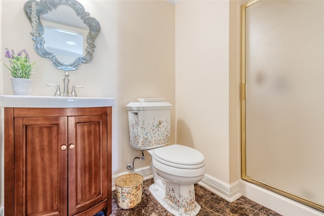 bathroom with vanity, toilet, and walk in shower