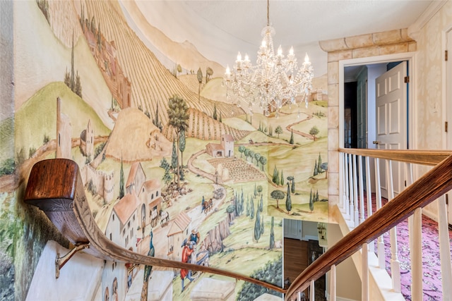 stairway featuring an inviting chandelier