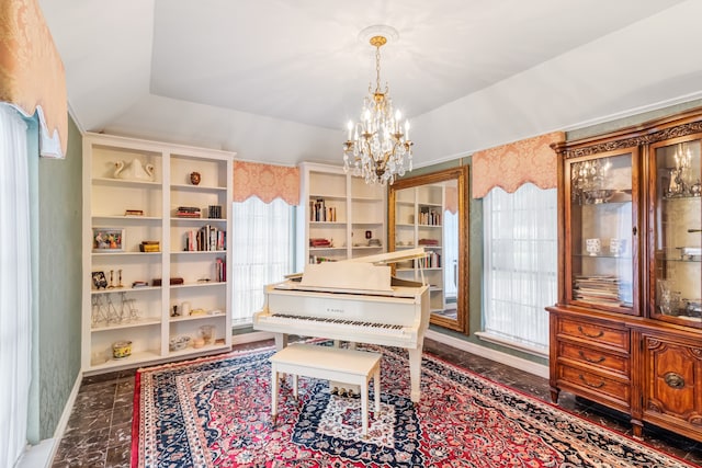 miscellaneous room with vaulted ceiling, a notable chandelier, and a healthy amount of sunlight