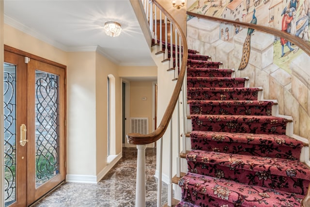 entryway featuring ornamental molding