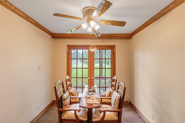 dining area with ceiling fan, ornamental molding, and french doors