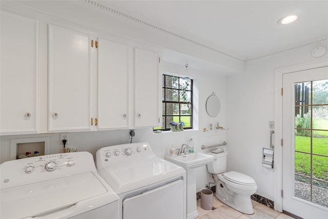 washroom with light tile patterned floors and independent washer and dryer