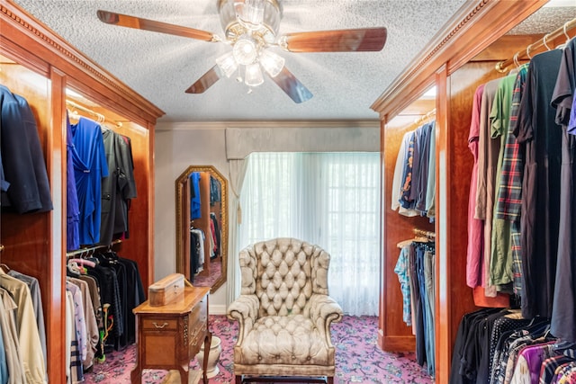 walk in closet featuring ceiling fan