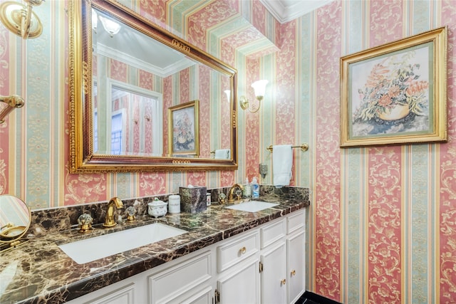 bathroom featuring ornamental molding and vanity