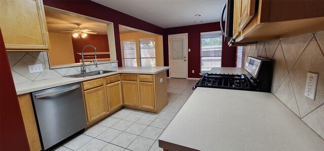 kitchen featuring light tile patterned floors, dishwasher, sink, kitchen peninsula, and ceiling fan