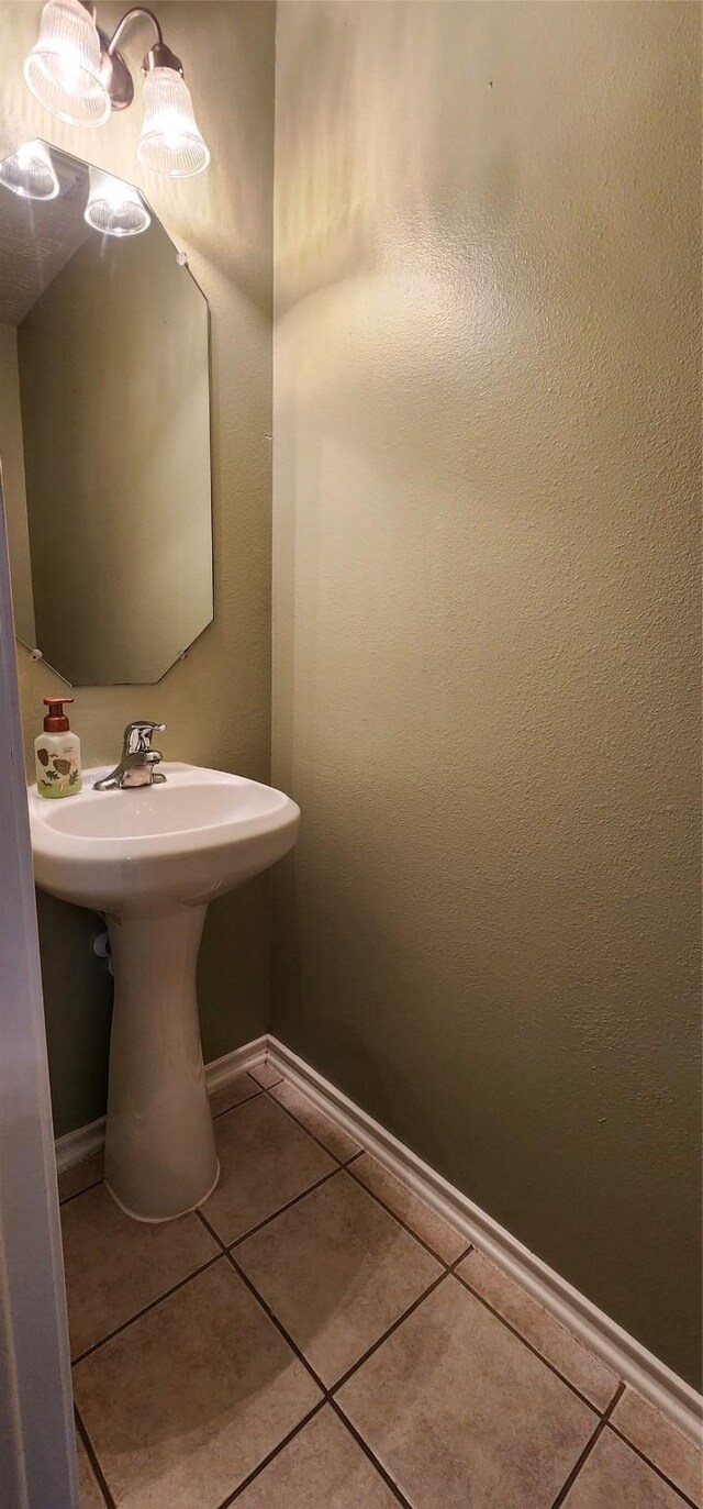 bathroom with tile patterned flooring