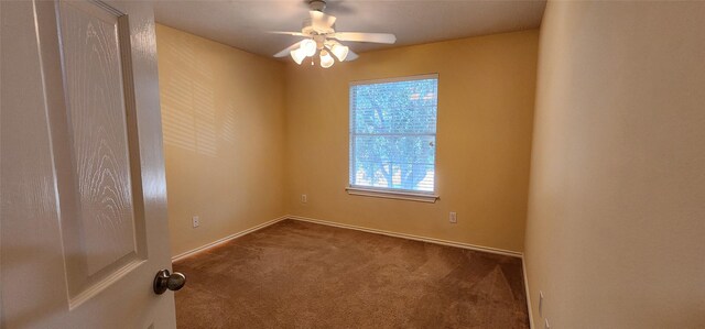 unfurnished room with ceiling fan and carpet floors