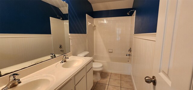 full bathroom featuring tiled shower / bath combo, vanity, toilet, and tile patterned flooring