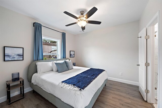 bedroom featuring dark hardwood / wood-style flooring and ceiling fan