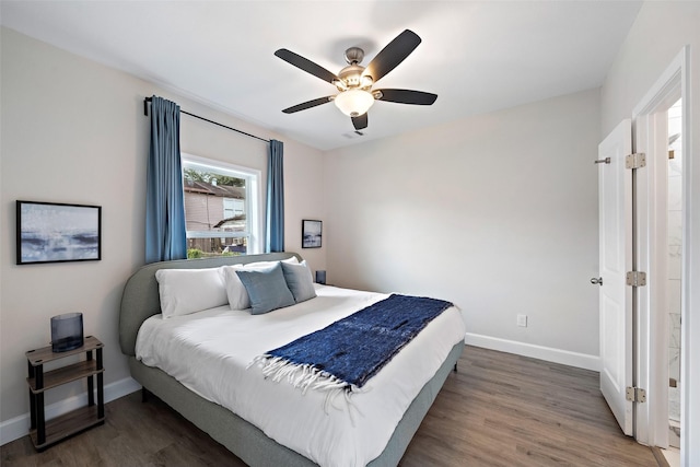 bedroom with ceiling fan and dark hardwood / wood-style flooring