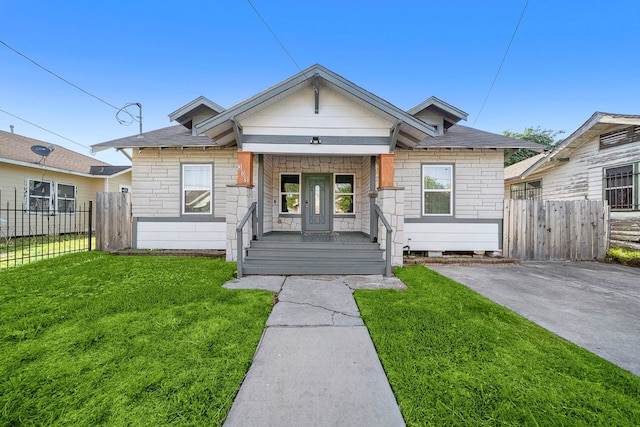 bungalow-style home featuring a front yard and a porch