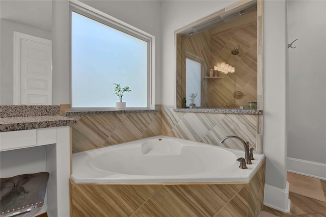 bathroom with vanity and separate shower and tub