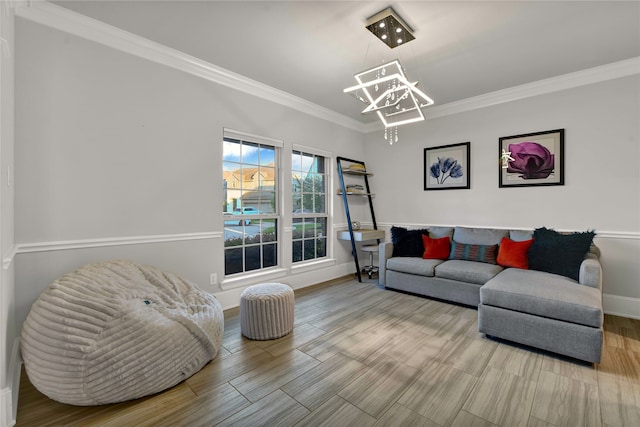 living room featuring ornamental molding, an inviting chandelier, and hardwood / wood-style floors