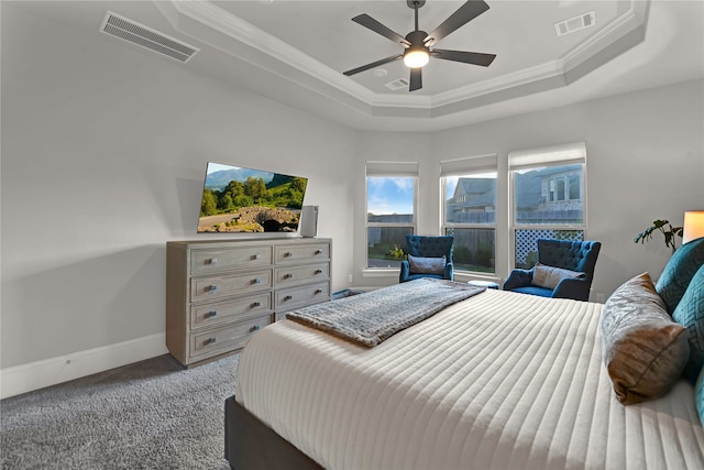 bedroom featuring a raised ceiling, crown molding, ceiling fan, and light colored carpet