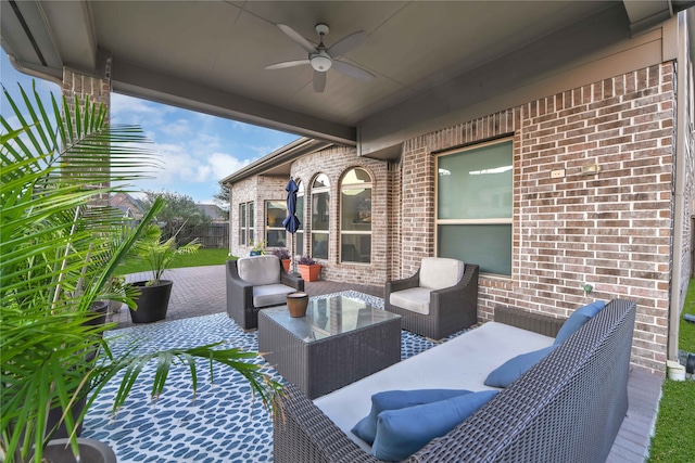 view of patio / terrace with an outdoor living space and ceiling fan