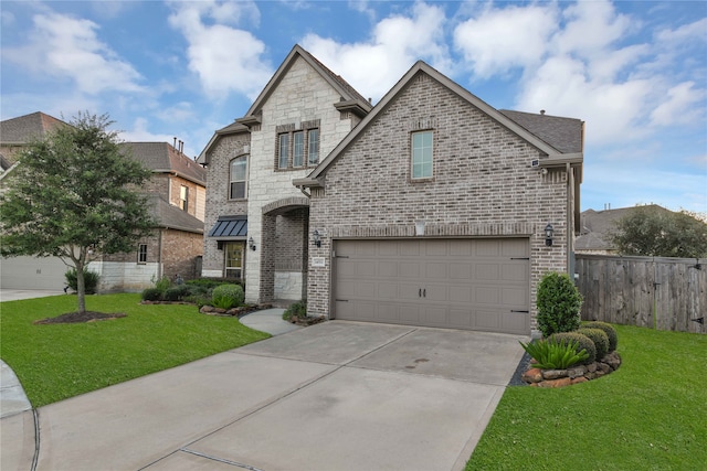 view of front facade featuring a garage and a front yard