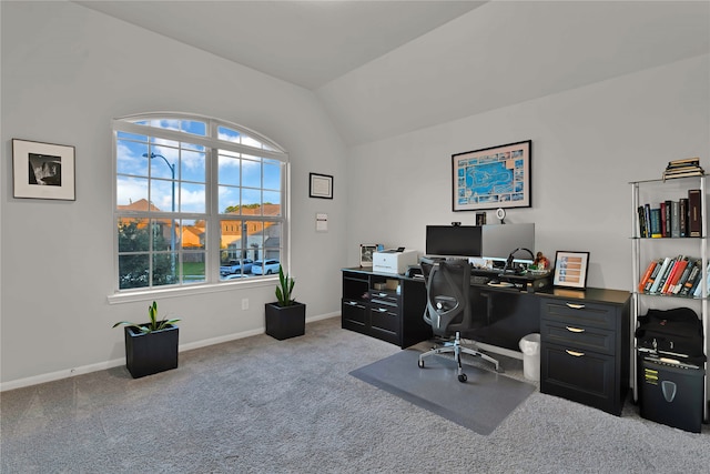 office area featuring light carpet and lofted ceiling