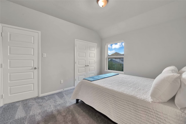 bedroom with carpet and vaulted ceiling