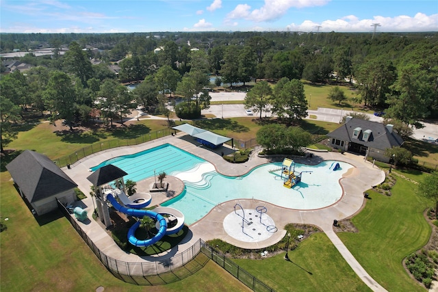 view of swimming pool with a patio and a water slide