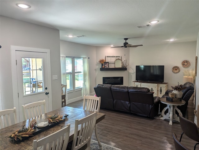 dining room featuring ceiling fan and dark hardwood / wood-style flooring