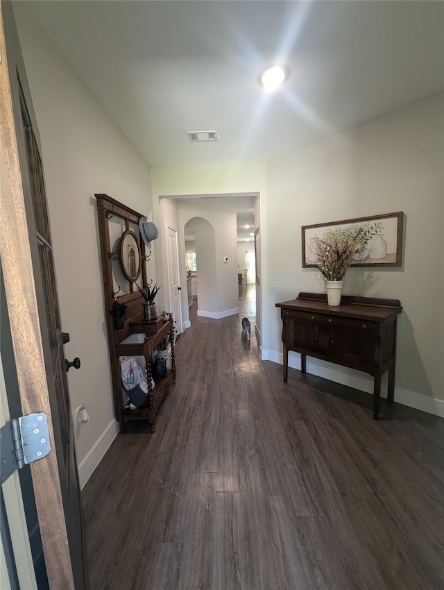 hallway featuring dark wood-type flooring