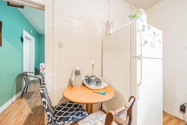 dining area with light hardwood / wood-style floors