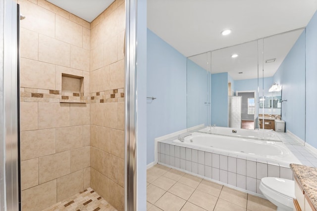 full bath featuring tile patterned flooring, a shower stall, toilet, vanity, and a garden tub