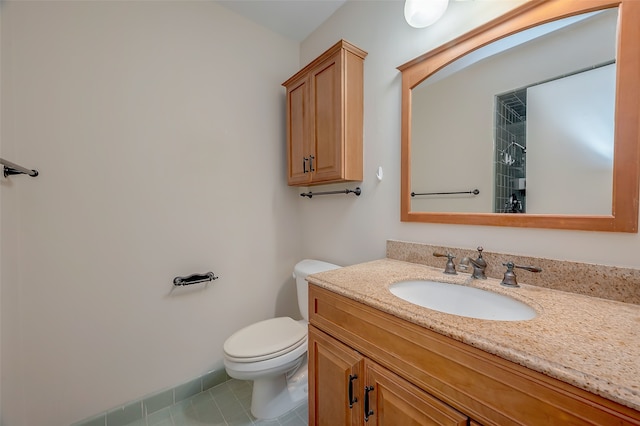 bathroom featuring vanity, toilet, and tile patterned floors