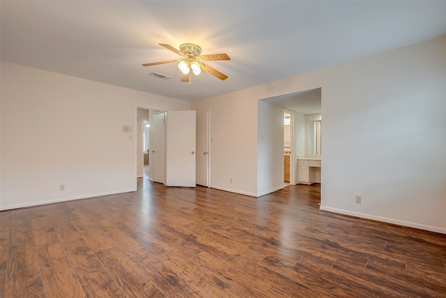 spare room with ceiling fan and dark hardwood / wood-style flooring