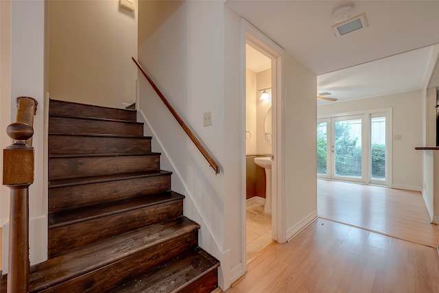 staircase featuring hardwood / wood-style floors